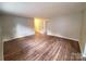 Spacious living room featuring hardwood flooring, neutral walls and recessed lighting at 5628 Anderson Rd, Charlotte, NC 28269