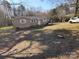 View of single-story house and the yard at 5628 Anderson Rd, Charlotte, NC 28269