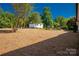 Expansive, treed backyard featuring a storage building for extra outdoor storage space at 6057 Highway 97 Hwy, Hickory Grove, SC 29717