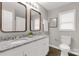 Bright bathroom features a double sink vanity with granite countertop and modern fixtures at 6057 Highway 97 Hwy, Hickory Grove, SC 29717