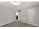 Carpeted bedroom features a white door, neutral colors and natural light at 6057 Highway 97 Hwy, Hickory Grove, SC 29717