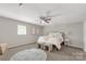 Bright bedroom featuring a bed, ceiling fan, neutral walls and flooring at 6057 Highway 97 Hwy, Hickory Grove, SC 29717