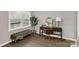 Bedroom featuring a vanity, large windows overlooking a porch, and a stylish upholstered bench at 6057 Highway 97 Hwy, Hickory Grove, SC 29717