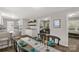 Dining area showcasing an open floor plan with hardwood floors, connecting to a modern kitchen and living room at 6057 Highway 97 Hwy, Hickory Grove, SC 29717