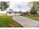 Spacious one-story home boasts a newly paved driveway and a charming front porch. Freshly painted exterior at 6057 Highway 97 Hwy, Hickory Grove, SC 29717