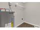 Laundry room featuring water heater and wire shelf at 6057 Highway 97 Hwy, Hickory Grove, SC 29717