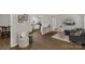 Open-concept living room featuring modern decor, hardwood floors, and seamless flow to the kitchen at 6057 Highway 97 Hwy, Hickory Grove, SC 29717