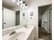 Bathroom with a double sink vanity and a view of the stairs at 6114 Abergele Ln, Matthews, NC 28104