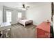Bedroom featuring neutral carpet, ceiling fan, and natural light at 6114 Abergele Ln, Matthews, NC 28104