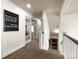 Upstairs hallway with view of stairs, carpet, and a decorative sign at 6114 Abergele Ln, Matthews, NC 28104