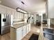 Well-appointed kitchen with stainless steel appliances, granite countertops, and an island, next to a dining area at 6114 Abergele Ln, Matthews, NC 28104