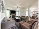 Inviting living room features a fireplace, neutral-toned furnishings, and a view into the dining area and kitchen at 6114 Abergele Ln, Matthews, NC 28104