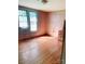 Bedroom with hardwood floors, neutral walls, a vintage dresser, and natural light at 6309 New Town Rd, Waxhaw, NC 28173