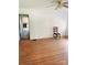 Living room with hardwood floors, ceiling fan and view into the kitchen of the property at 6309 New Town Rd, Waxhaw, NC 28173