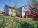 Backyard featuring a wooden deck with stairs and beautiful landscaping at 7524 Common Oak Dr, Stanley, NC 28164