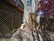 Exterior basement access with stone groundcover and mature trees at 7524 Common Oak Dr, Stanley, NC 28164