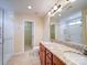 Stylish bathroom features double vanity, granite countertops, and walk-in shower at 7524 Common Oak Dr, Stanley, NC 28164
