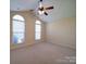 Spacious bedroom with carpet, vaulted ceilings, and large windows at 7524 Common Oak Dr, Stanley, NC 28164