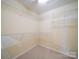 Walk-in closet with custom shelving offers ample storage solutions at 7524 Common Oak Dr, Stanley, NC 28164