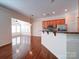 Open kitchen with granite countertops, and stainless steel appliances, adjoining a bright living area at 7524 Common Oak Dr, Stanley, NC 28164