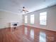 Bright living room features fireplace, hardwood floors and natural light at 7524 Common Oak Dr, Stanley, NC 28164