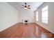 Spacious living room features fireplace, hardwood floors, and natural light at 7524 Common Oak Dr, Stanley, NC 28164