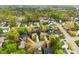 Enjoy this aerial view of a neighborhood featuring mature trees and well-maintained homes in a suburban community at 8619 Delamere Ln, Charlotte, NC 28269
