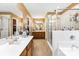 Bathroom featuring double vanity, walk-in shower, and a spacious layout at 8619 Delamere Ln, Charlotte, NC 28269