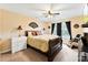Bedroom with neutral walls, large window, and dark wood furniture at 8619 Delamere Ln, Charlotte, NC 28269