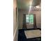 Bedroom featuring a window with curtains and track lighting, and a decorative rug at 8619 Delamere Ln, Charlotte, NC 28269