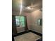 Bedroom featuring a window with curtains and track lighting, and a decorative rug at 8619 Delamere Ln, Charlotte, NC 28269