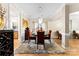 Elegant dining room featuring a crystal chandelier, hardwood floors, and stylish decor at 8619 Delamere Ln, Charlotte, NC 28269