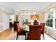 Elegant dining room featuring a crystal chandelier, hardwood floors, and stylish decor at 8619 Delamere Ln, Charlotte, NC 28269
