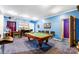 Fun game room with a pool table, bar area, and plenty of seating for entertaining at 8619 Delamere Ln, Charlotte, NC 28269