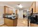 Spacious kitchen featuring granite countertops, stainless steel appliances and hardwood floors at 8619 Delamere Ln, Charlotte, NC 28269