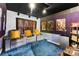 Movie room with plush seating, ambient lighting, and soundproofing at 8619 Delamere Ln, Charlotte, NC 28269