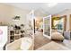 Inviting sitting area with french doors leading to a bedroom, featuring a cozy chaise lounge and ample natural light at 8619 Delamere Ln, Charlotte, NC 28269