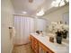 Bathroom with a wood vanity and shower/tub combo at 920 Ashworth Dr, Gastonia, NC 28054