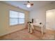 Bedroom featuring a desk, a ceiling fan, and a large window at 920 Ashworth Dr, Gastonia, NC 28054