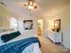Bedroom with a ceiling fan, white dresser, and ensuite bathroom view at 920 Ashworth Dr, Gastonia, NC 28054