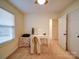 Carpeted bedroom features a desk, a ceiling fan, and closet at 920 Ashworth Dr, Gastonia, NC 28054
