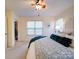 Bedroom with a ceiling fan, closet, and two windows for natural light at 920 Ashworth Dr, Gastonia, NC 28054