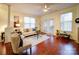 Comfortable living room with plenty of natural light, hardwood floors, and stylish furnishings at 920 Ashworth Dr, Gastonia, NC 28054