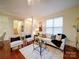 Bright and airy living room with hardwood floors and stylish decor creating a cozy living space at 920 Ashworth Dr, Gastonia, NC 28054