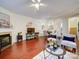 Bright and open living room with hardwood floors, fireplace, and decorative art at 920 Ashworth Dr, Gastonia, NC 28054