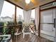 Inviting screened porch with chairs, accent table, patterned rug, and views of the neighborhood at 920 Ashworth Dr, Gastonia, NC 28054