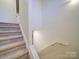 Carpeted stairway with white railing at 920 Ashworth Dr, Gastonia, NC 28054