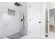 Modern bathroom featuring a white marble shower with black hardware and mosaic tile at 103 Devonshire Ln, Salisbury, NC 28146
