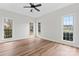 Spacious bedroom with gleaming hardwood floors and large windows for ample natural light at 103 Devonshire Ln, Salisbury, NC 28146