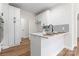 Modern kitchen featuring stainless steel appliances, white cabinets, breakfast bar and tile backsplash at 103 Devonshire Ln, Salisbury, NC 28146
